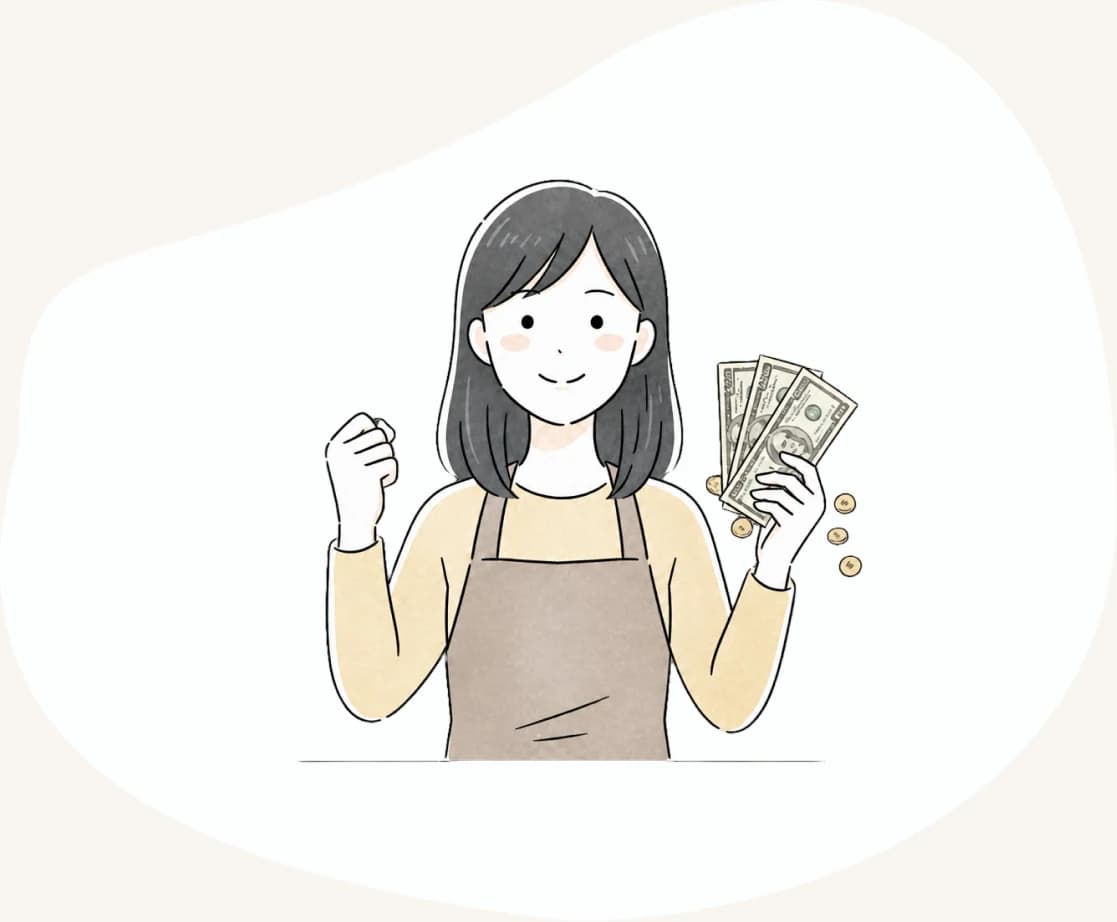 現地で働いて得た給料を手にする女性